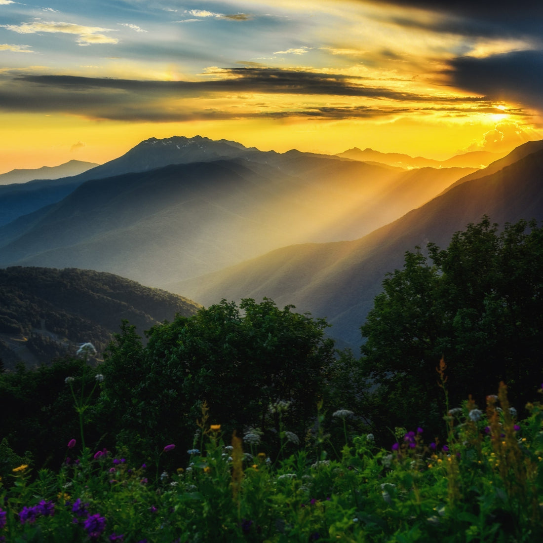 Sun Breaking Through Clouds Over Mountains  Symbolizing Jesus Coming Down From Heaven